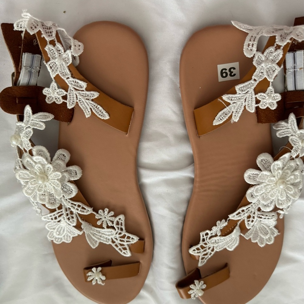 White lace and pearl flat sandals. Insert toe,adorned with lace flower and pearl